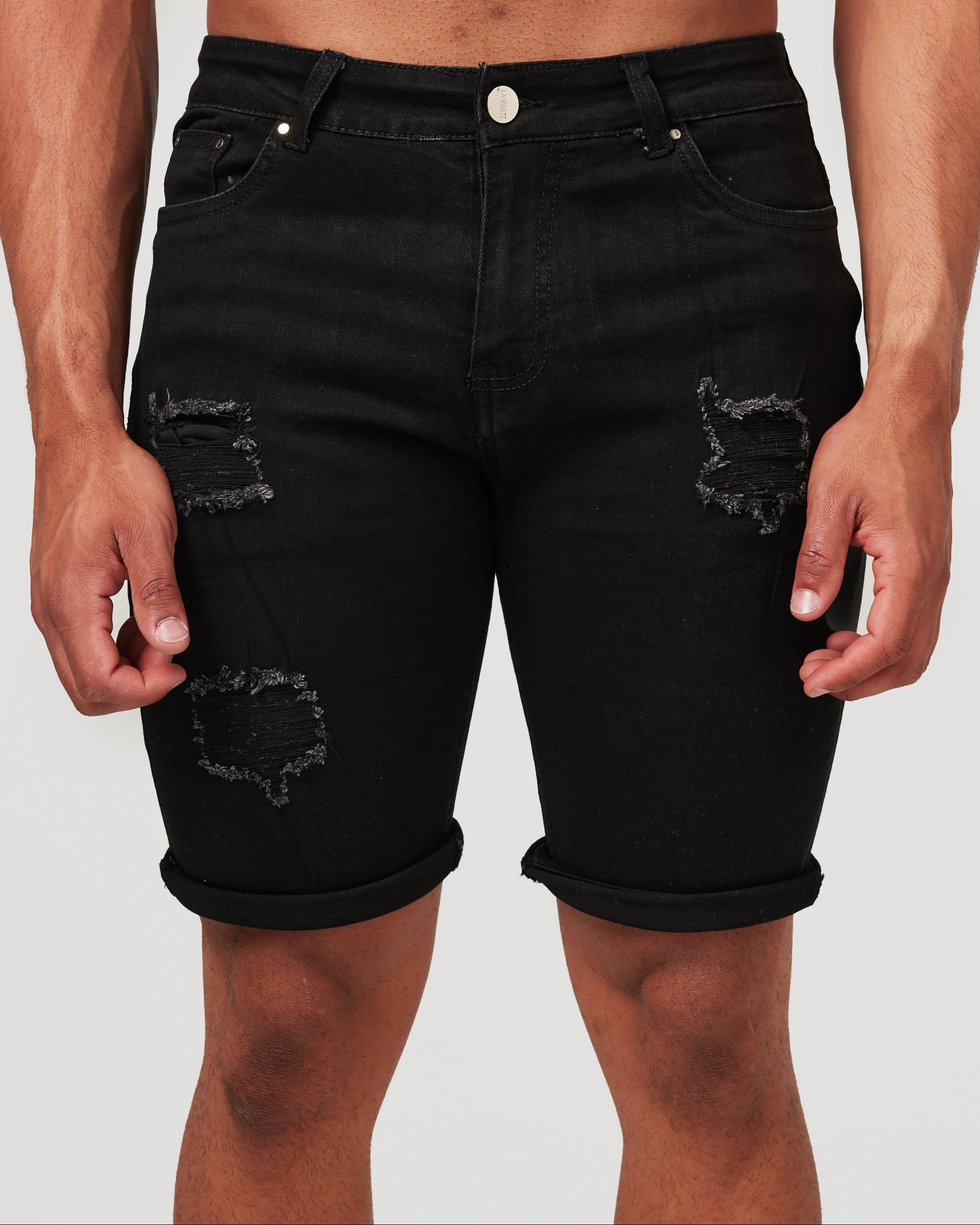 Shorts en jean noirs déchirés