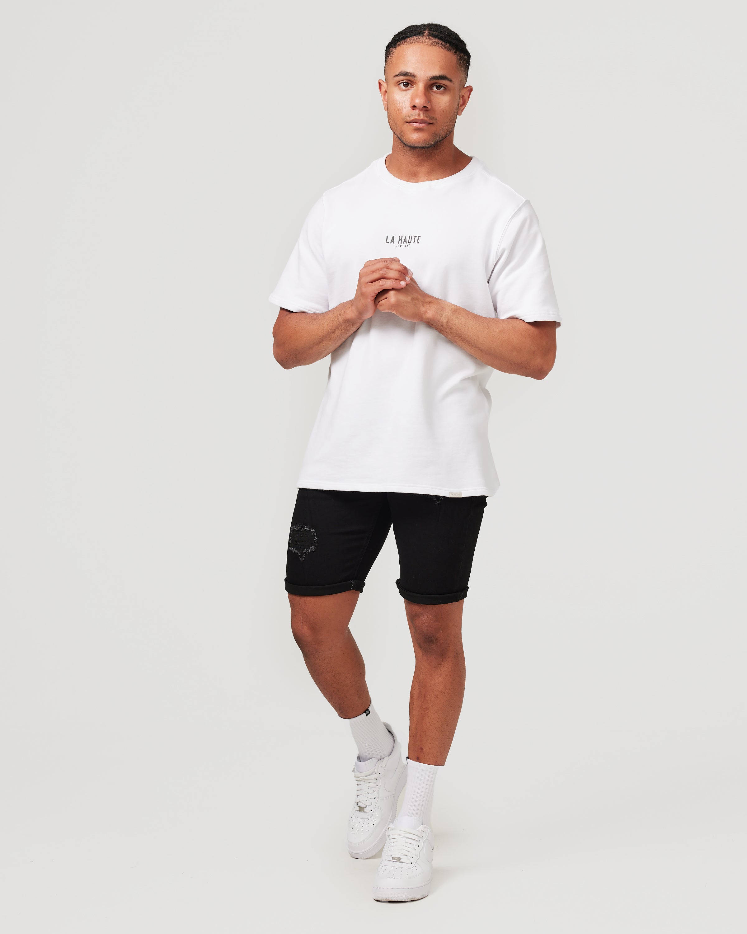 Shorts en jean noirs déchirés