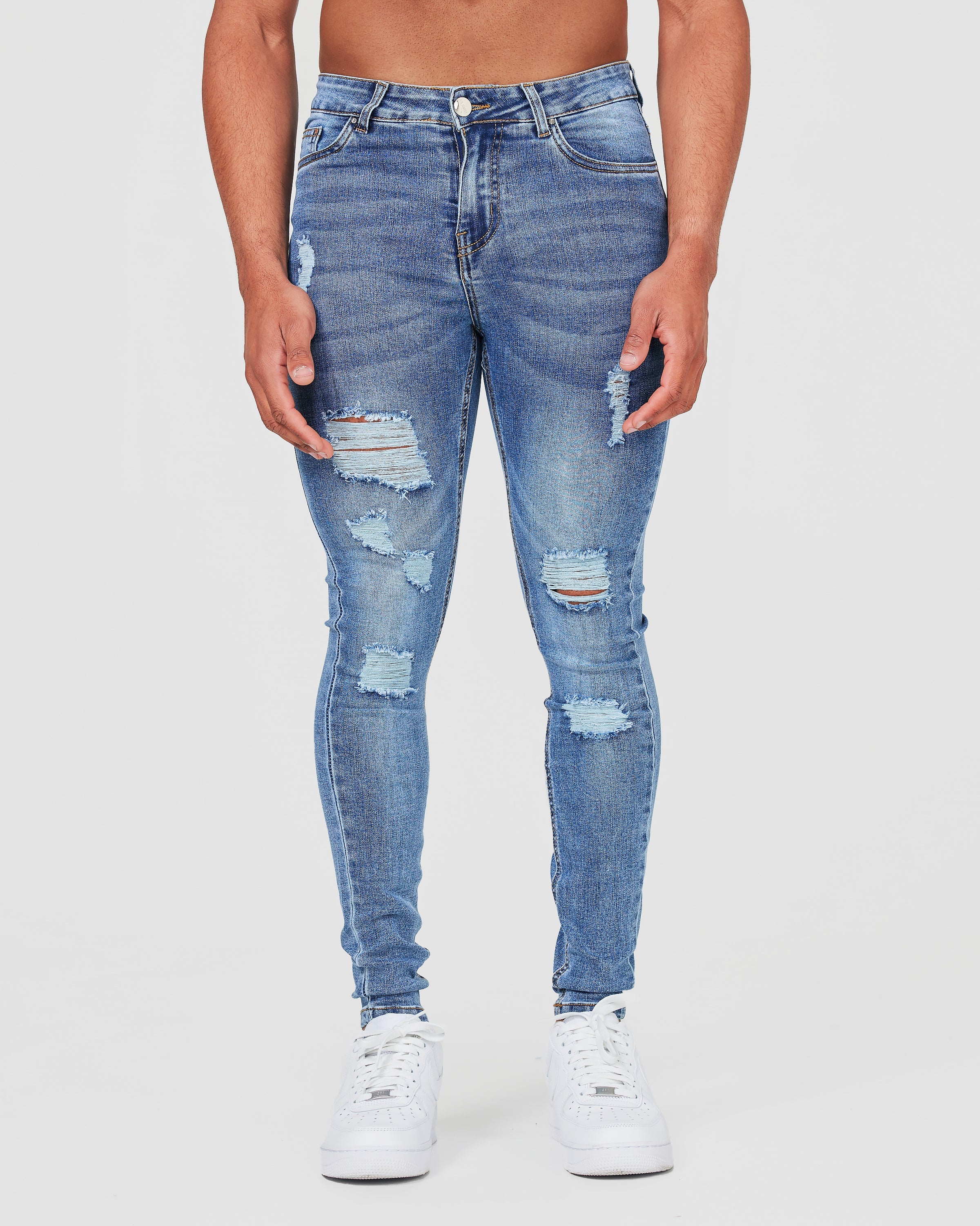 Jean skinny bleu délavé avec détails déchirés