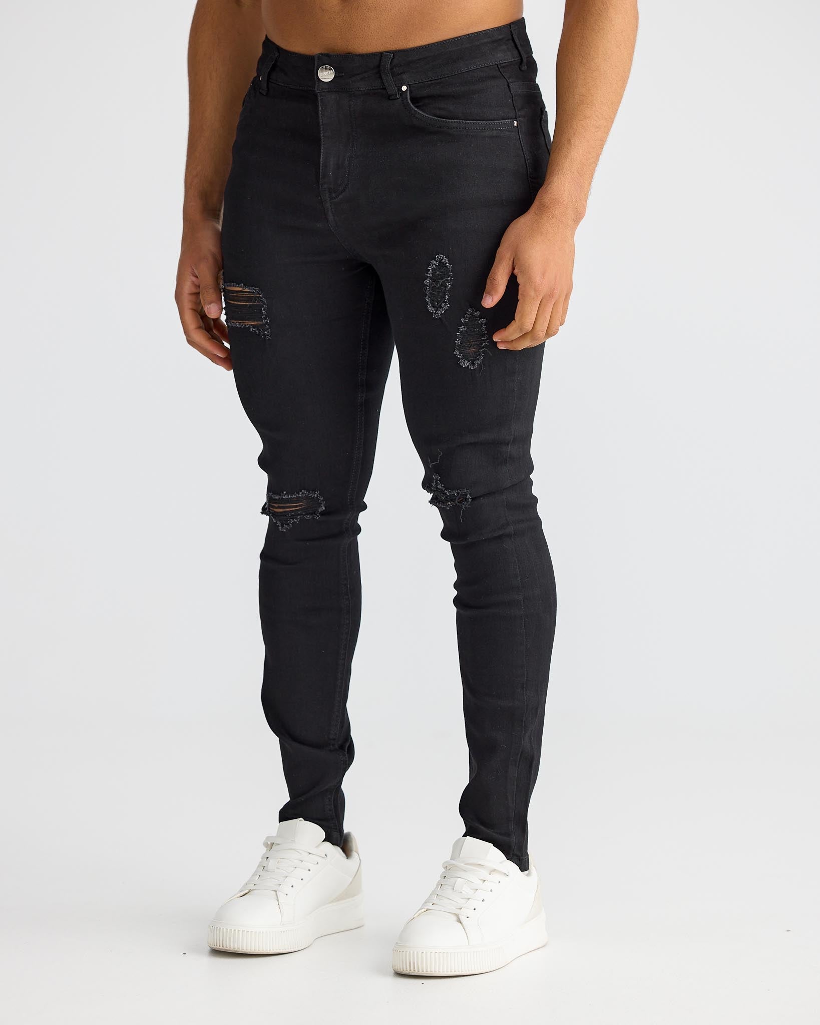 Jeans skinny noirs déchirés - denim usé et audacieux avec coupe slim