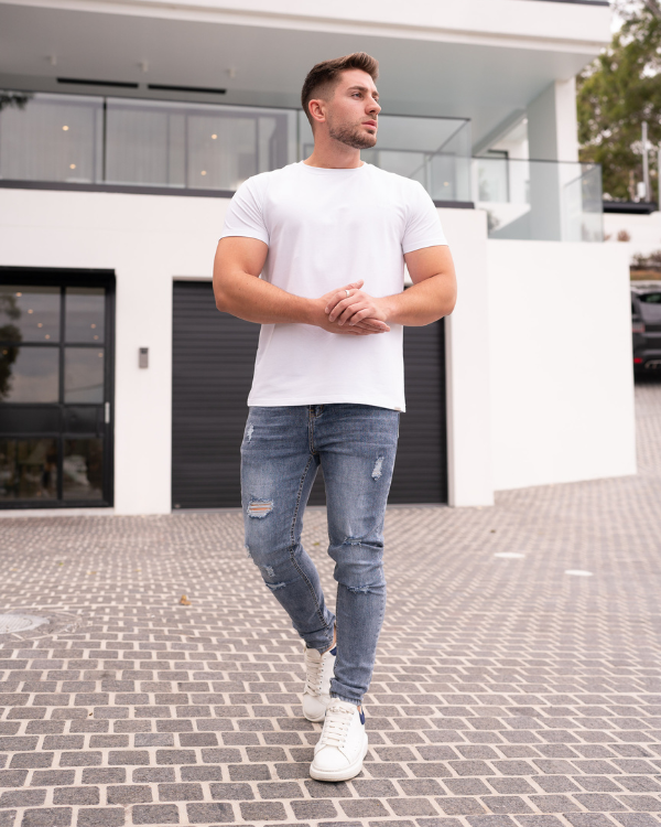 Jean skinny bleu délavé avec détails déchirés