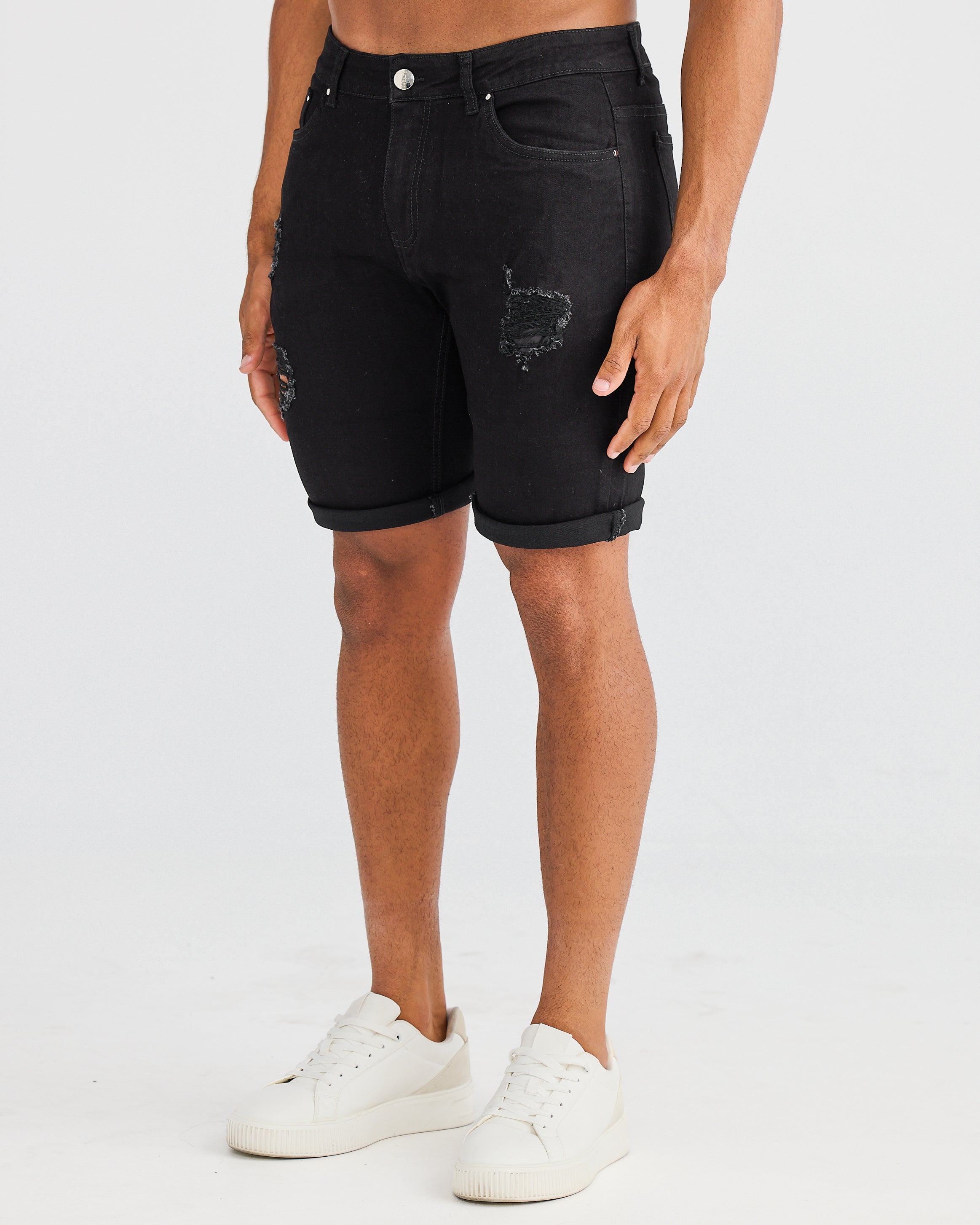 Shorts en jean noirs déchirés