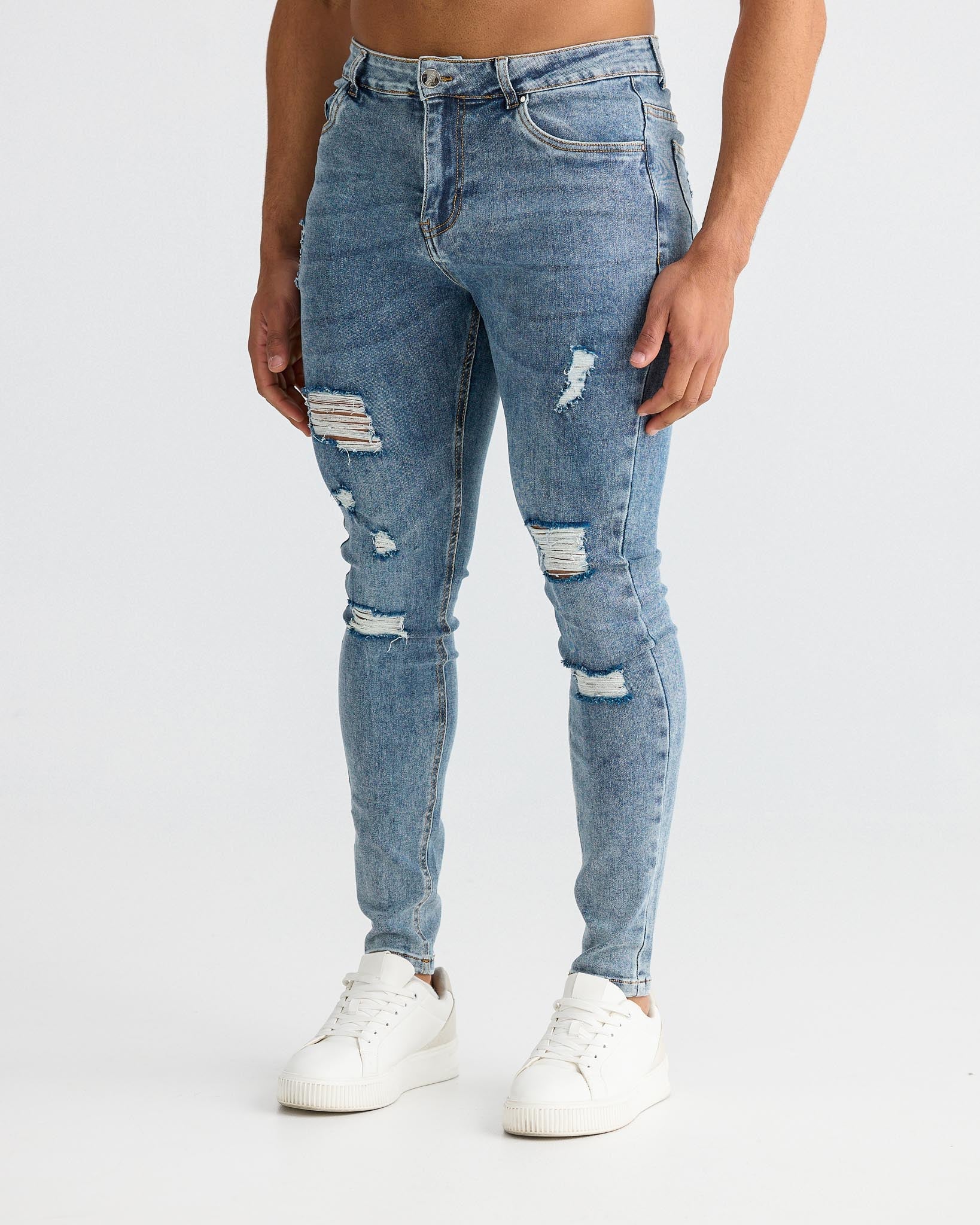 Jean skinny bleu délavé avec détails déchirés