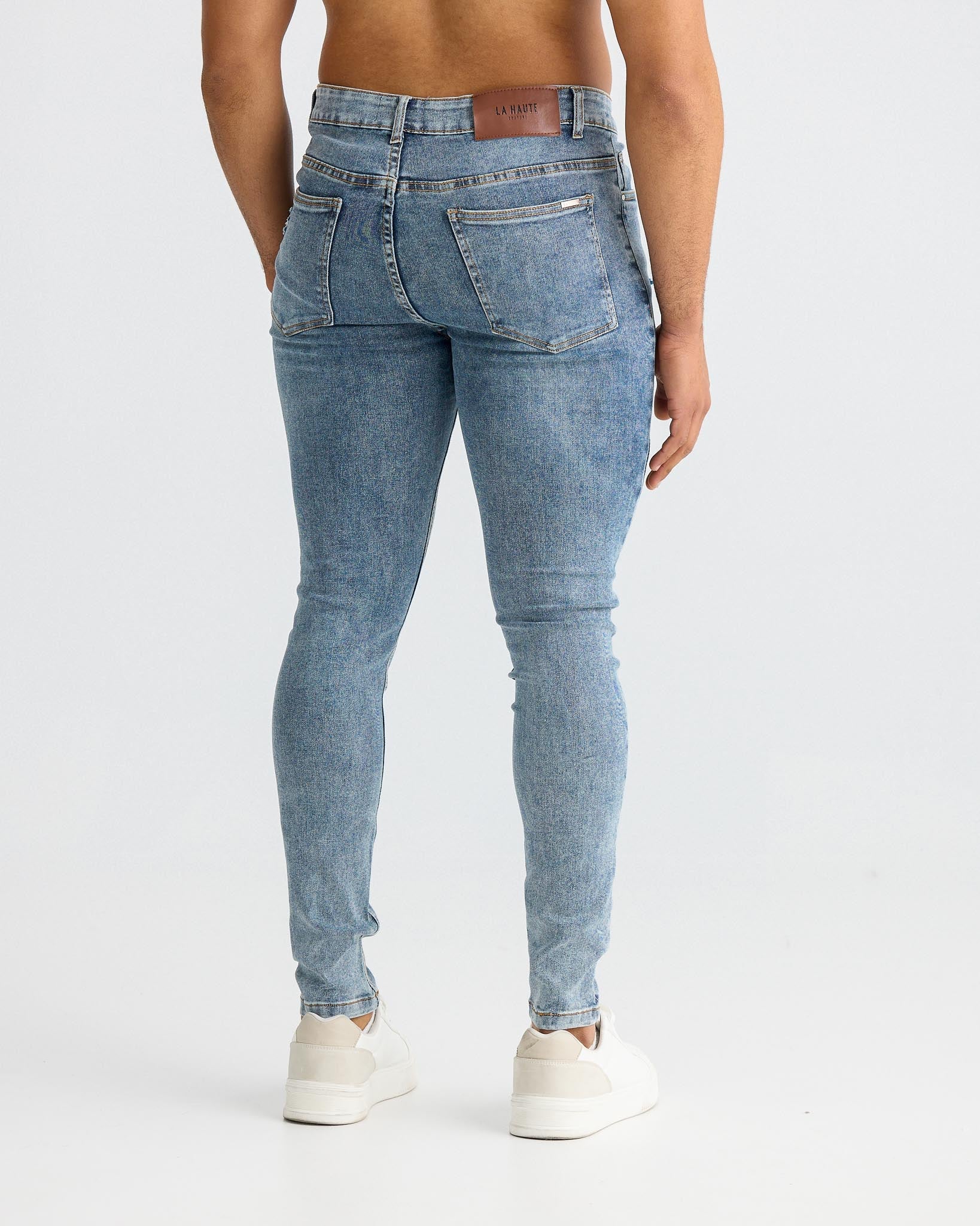 Jean skinny bleu délavé avec détails déchirés